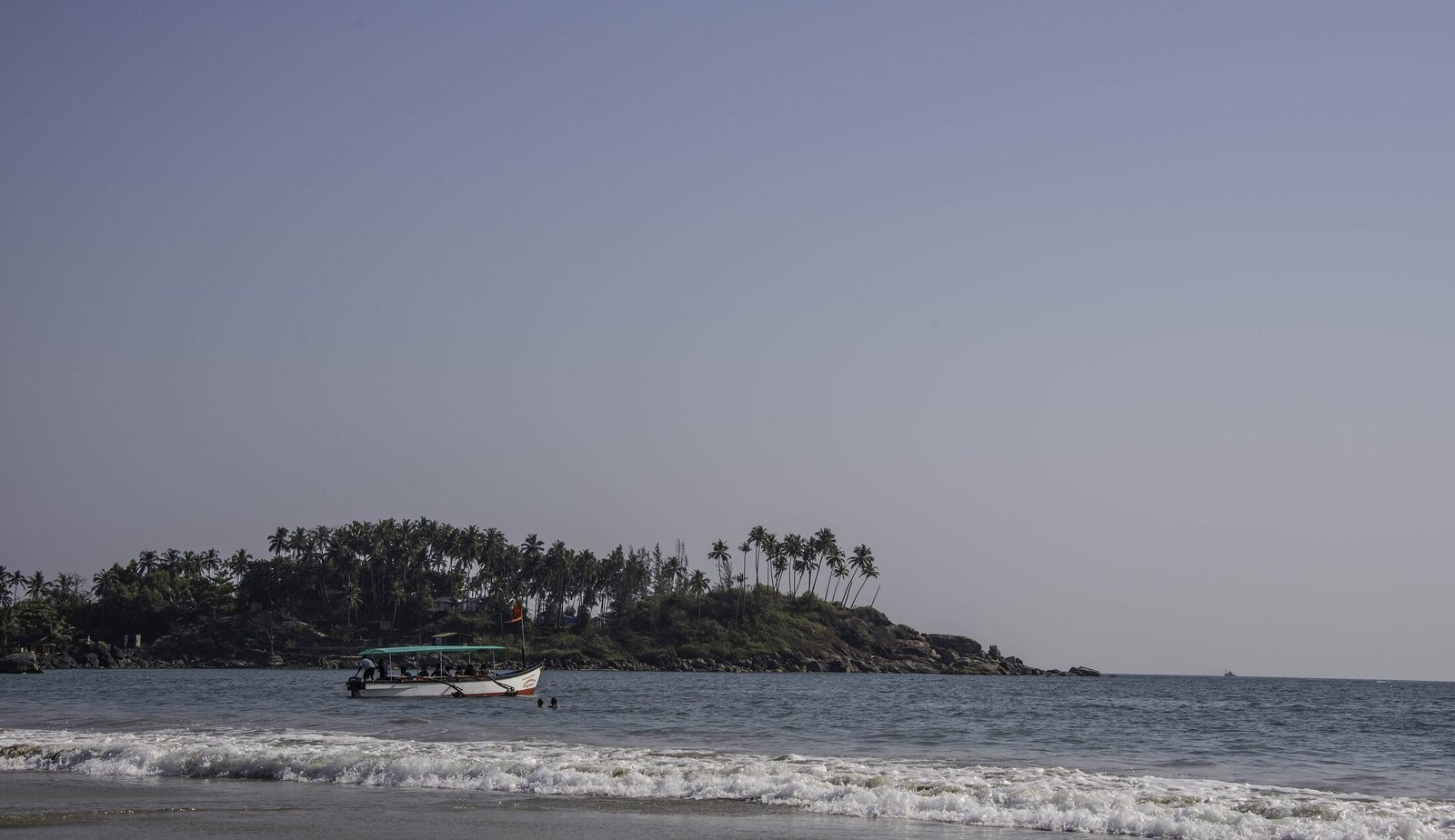 The calm, palm-fringed crescent of Palolem Beach in serene South Goa