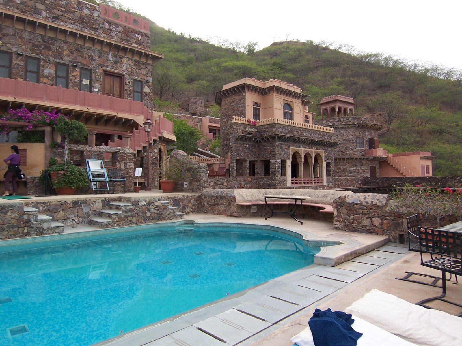 A turquoise pool on the restored stone terraces of the Neemrana Fort-Palace heritage hotel near Delhi