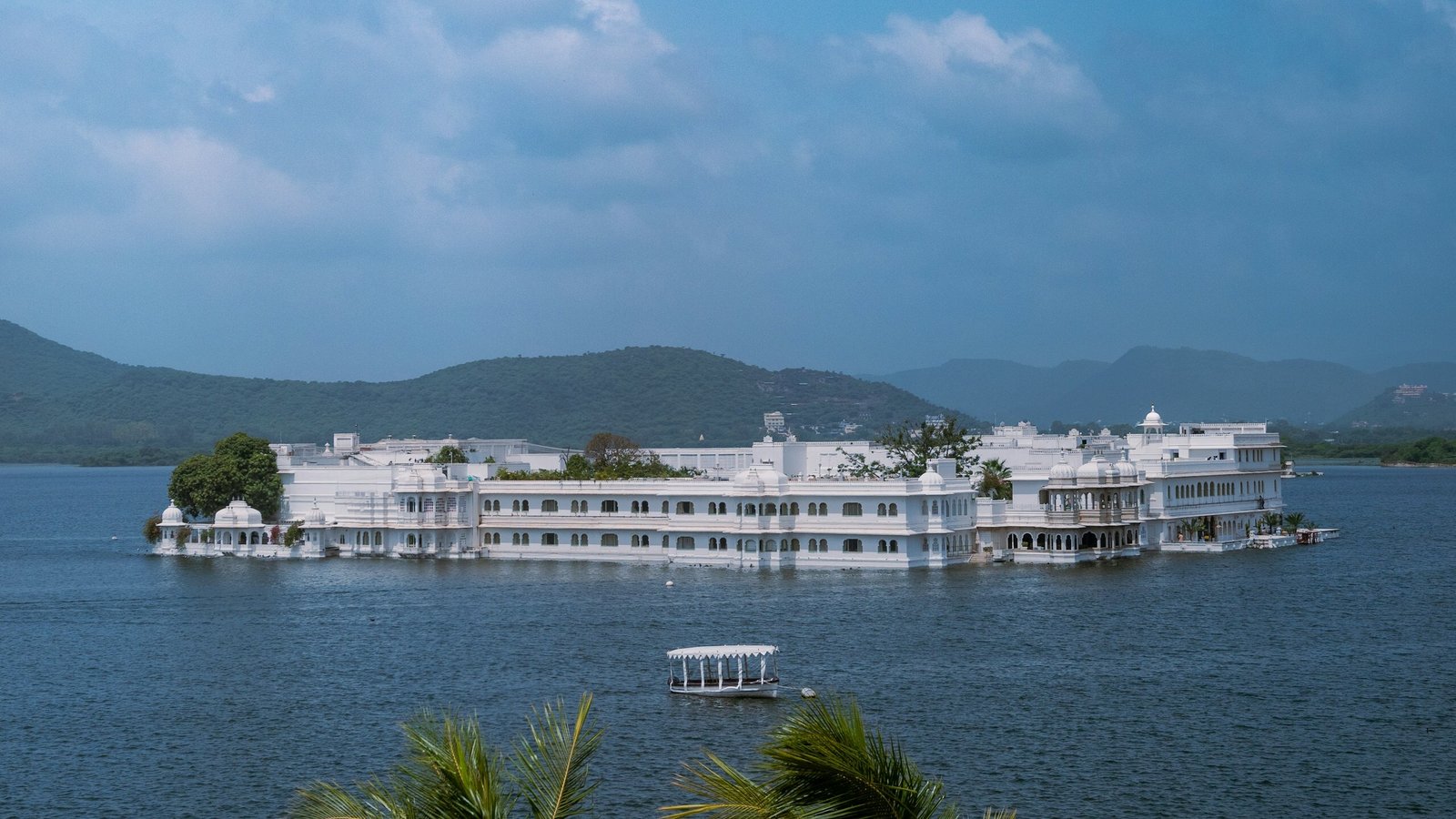 A white marble heritage palace hotel floating on Lake Pichola, Udaipur